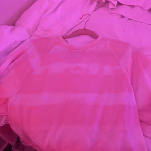 pink and white cropped crew neck sweatshirt